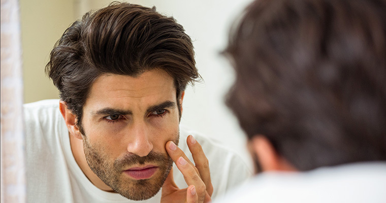 Man-Looking-At-Himself-In-The-Mirror